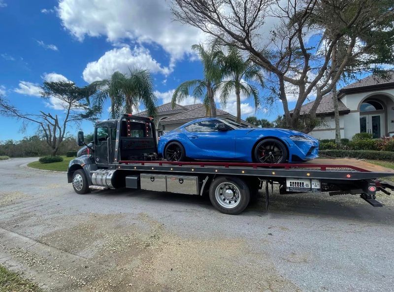 Sports car loaded on an AC’s Towing truck